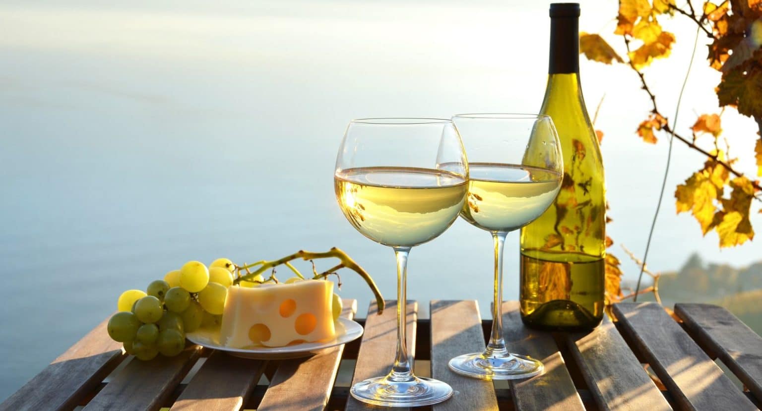 wine with grapes and sea view