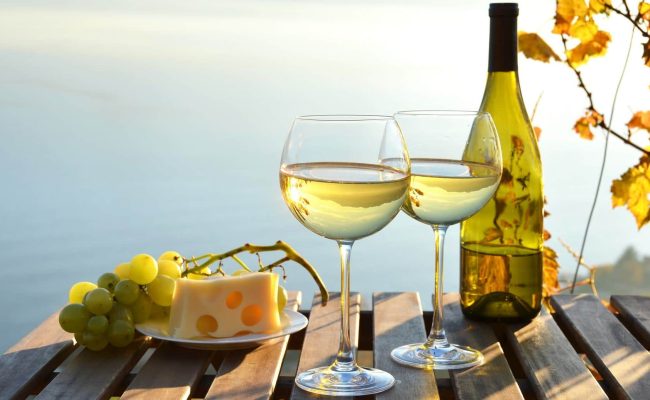 wine with grapes and sea view